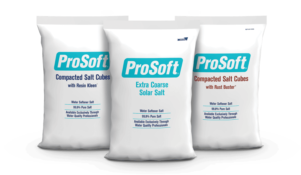 A bag of ProSoft Compacted Salt Cubes with Resin Kleen water softener salt next to a bag of ProSoft Extra Coarse Solar Salt water softener salt and a bag of ProSoft Compacted Salt Cubes with Rust Buster water softener salt.
